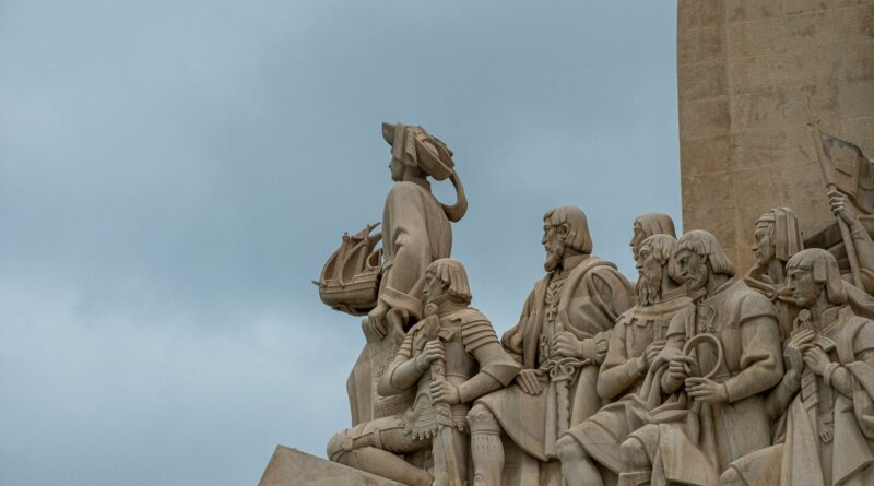 Historic Padrão dos Descobrimentos monument featuring explorers in Lisbon, Portugal.