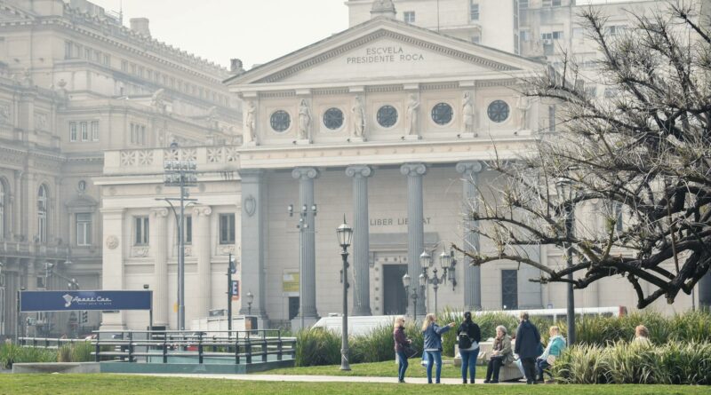 People gather at a park near Escuela Presidente Roca in Buenos Aires, Argentina.