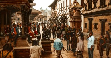 Vibrant street scene in Kathmandu, Nepal showcasing historical architecture and a diverse crowd.
