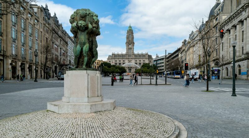 View of Porto City Hall and sculpture at Avenida dos Aliados, a Porto landmark.