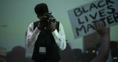 A photojournalist capturing a pivotal moment at a Black Lives Matter protest.