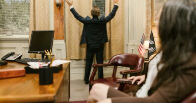 Two professionals in a lawyer's office engaged in a tense negotiation.