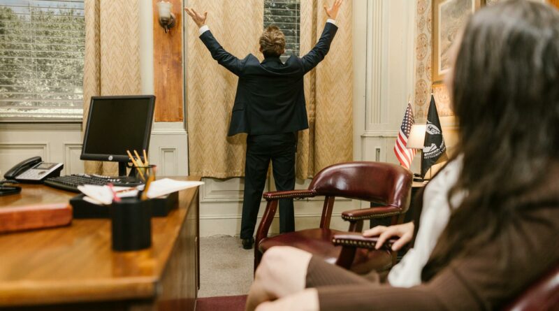 Two professionals in a lawyer's office engaged in a tense negotiation.