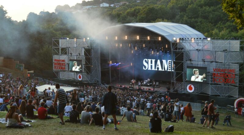 A lively outdoor concert at a music festival in Paredes de Coura, Portugal.