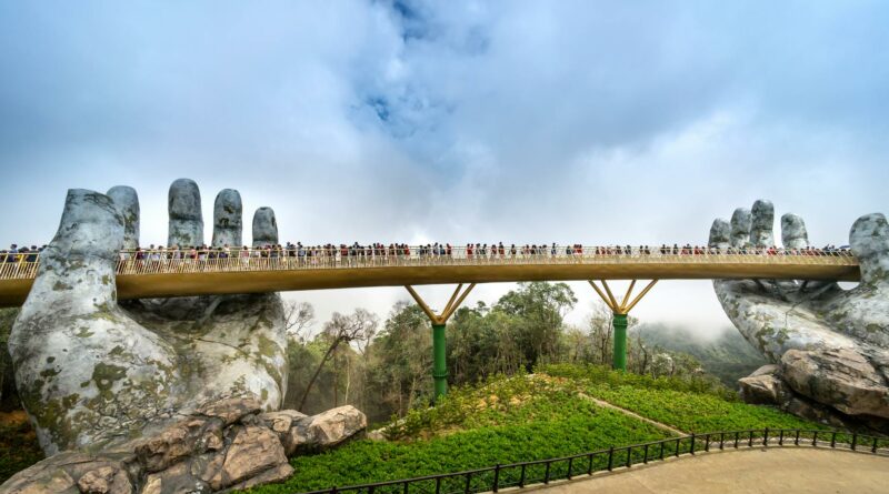 Golden Bridge in Da Nang held by giant stone hands, a popular tourist attraction.