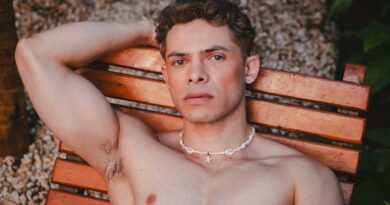 A man relaxes outdoors on a wooden chair in São Paulo, Brazil, showcasing serene elegance and style.