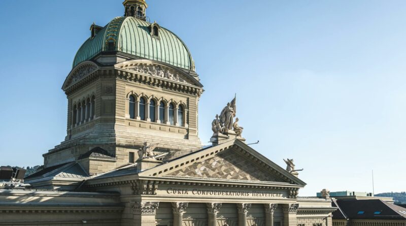 Exterior view of the Swiss Federal Palace in Bern, Switzerland, under clear skies.