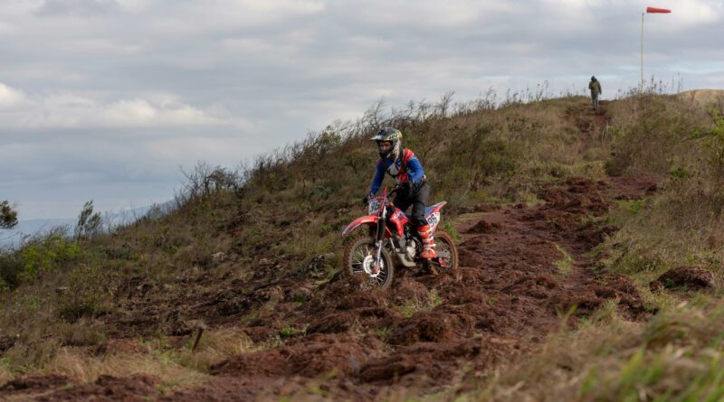 Thrilling motocross ride on rugged terrain in Minas Gerais, Brazil capturing the essence of adventure sports.