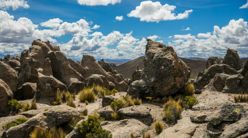 Explore the striking rock formations and lush vegetation of Novo Progresso, Brazil, beneath clear blue skies.