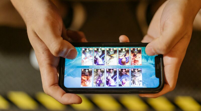 Close-up of hands playing a mobile game on a smartphone, showcasing the game's interface.