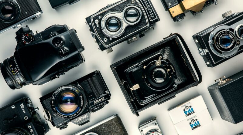 Flat lay of various vintage cameras showcasing classic design and retro charm.