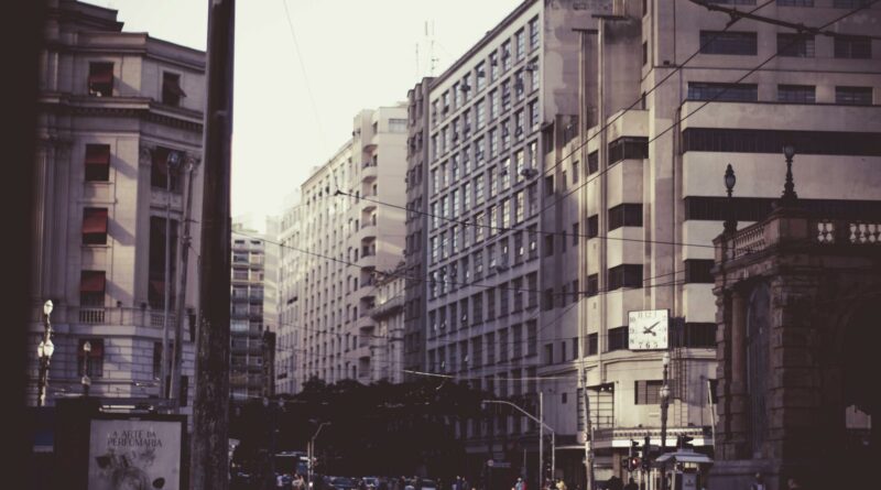 Bustling street scene in São Paulo, showcasing historic architecture and urban life.