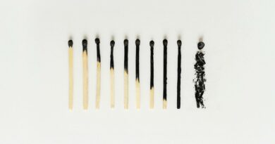 Minimalist photo showing series of matches to symbolize burnout and progression.