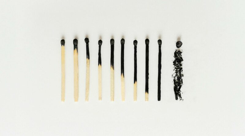 Minimalist photo showing series of matches to symbolize burnout and progression.