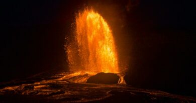 Stunning night capture of a fiery volcanic eruption in Hawaii with glowing lava.