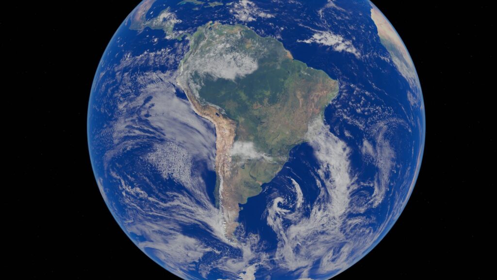 Vista aérea da floresta amazônica com rios e árvores, simbolizando a importância do Brasil na ação climática global.